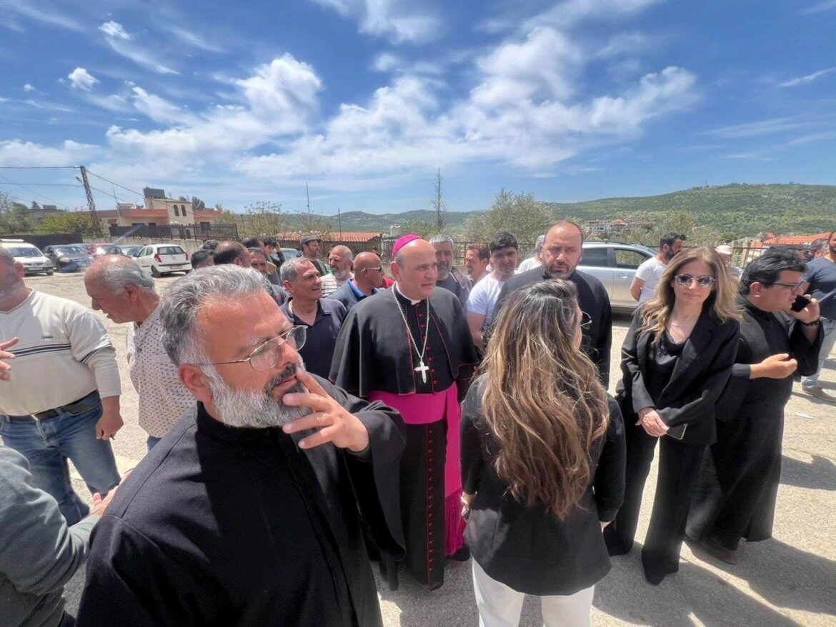 Father Fadi Felefli, left, Maronite Catholic parish priest at St. George Church in the village of Debel, southern Lebanon, and Archbishop Paulo Borgia, center, papal nuncio to Lebanon, accompany representatives of aid associations distributing humanitarian help to Christian villages in Debel in this photo posted April 25, 2026, on a Debel Alerts Facebook page. (OSV News/courtesy Debel Alerts)