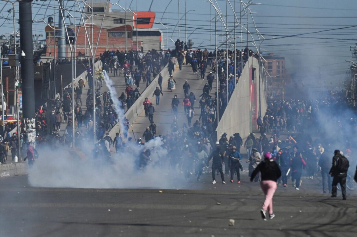Protesters run past tear gas as they demonstrate against President Rodrigo Paz's government amid an ongoing economic and fuel crisis in El Alto, Bolivia, May 16, 2026. (OSV News photo/Claudia Morales, Reuters)