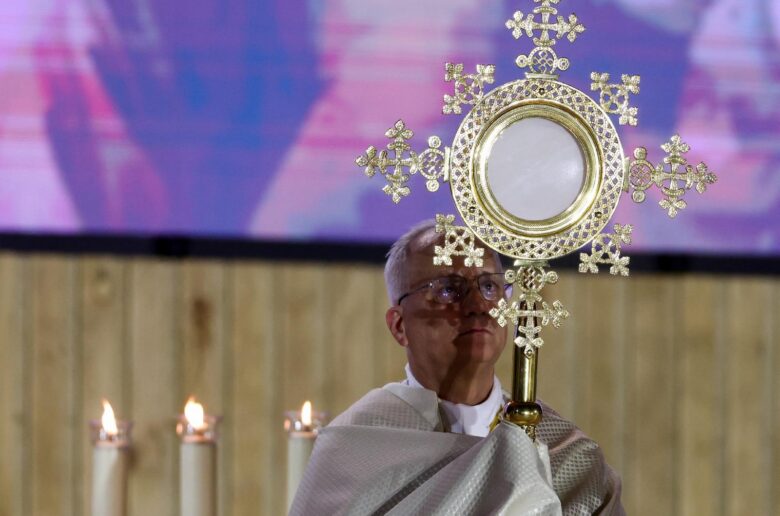 Pope Leo XIV holds the monstrance during a prayer vigil with young people at Plaza de Lima in Madrid June 6, 2026, during his apostolic journey to Spain. (OSV News/Yara Nardi, Reuters)
