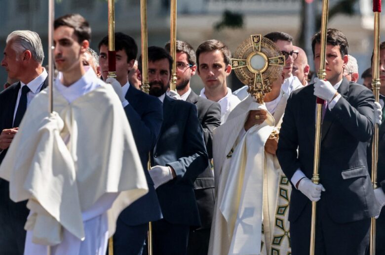 Pope Leo XIV holds the monstrance as he leads the Corpus Christi procession at Plaza de Cibeles in Madrid, June 7, 2026, during his apostolic journey to Spain. (OSV News photo/Yara Nardi, Reuters)