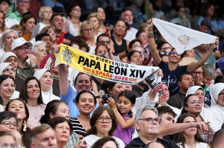 Pilgrims hold a banner as they wait for Pope Leo XIV to arrive for a meeting with the diocesan community at the Santiago Bernabeu Stadium in Madrid June 8, 2026, during his June 6-12 apostolic journey to Spain. (OSV News photo/Yara Nardi, Reuters)