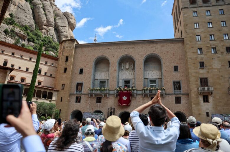 People gather outside the Abbey of Our Lady of Montserrat as Pope Leo XIV appears on a balcony, during his apostolic journey, in Montserrat, near Barcelona, June 10, 2026 during during his apostolic journey to  Spain. (OSV News photo/Yara Nardi, Reuters)