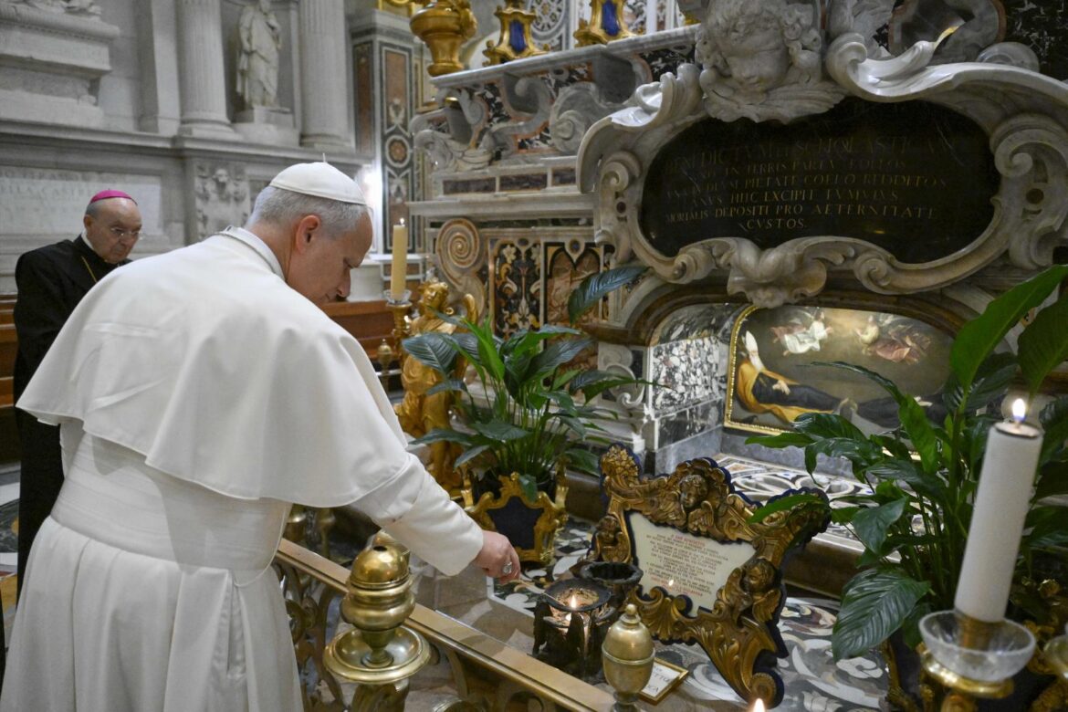 Pope Leo XIV lights a candle as he visits the Benedictine Abbey of Montecassino in the town of Cassino, Italy, July 20, 2026. (OSV News photo/Simone Risoluti, Vatican Media)