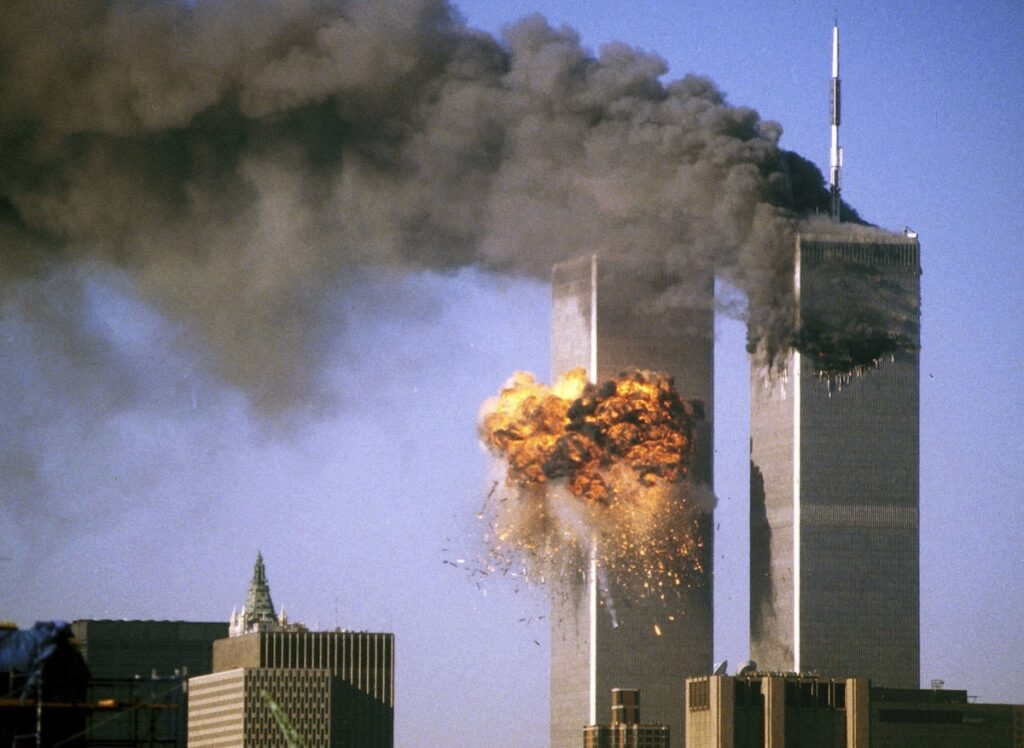 The south tower of the World Trade Center bursts into flames after being struck by United Airlines Flight 175 in New York in this Sept. 11, 2001, file photo. Twenty-five years after the 9/11 terror attacks that claimed the lives of nearly 3,000 people, Catholic family members who lost loved ones that day have credited their faith with getting through the losses. (OSV News photo/Sean Adair, Reuters)