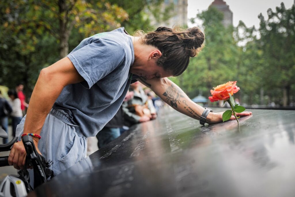Elizabeth Adams reacts at the 9/11 Memorial & Museum reflecting pool in the Manhattan borough of New York City, Sept. 10, 2025, ahead of the 24th anniversary of the Sept. 11, 2001, attacks on the World Trade Center. Twenty-five years after the 9/11 terrorism attacks that claimed the lives of nearly 3,000 people, Catholic family members who lost loved ones that day have credited their faith with getting through the losses. (OSV News photo/Jeenah Moon, Reuters)