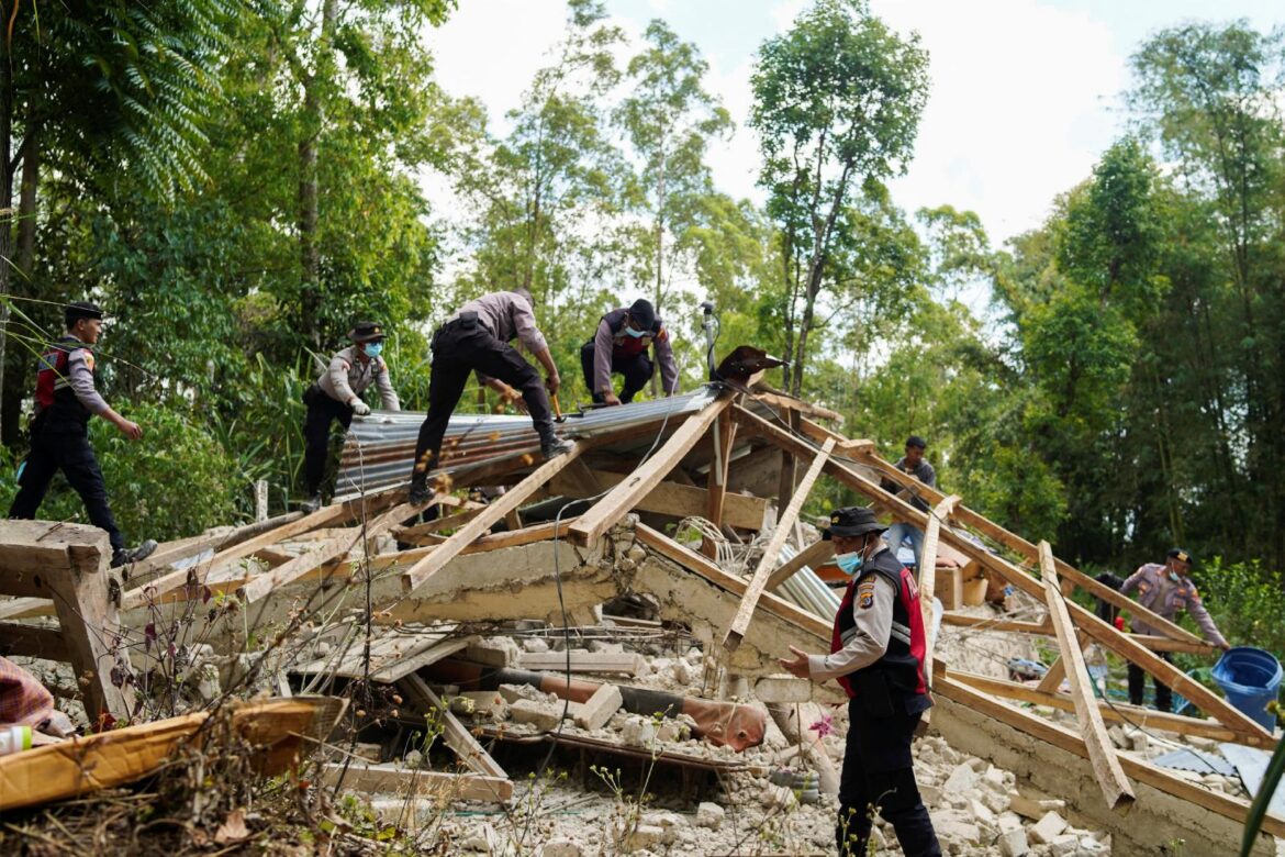 Police officers inspect a heavily-damaged house after an earthquake was felt in Manggarai, East Nusa Tenggara province, Indonesia, Aug. 16, 2026. A powerful 7.7-magnitude earthquake struck the country's eastern coast early Aug. 15, local time, killing over 50 people and leaving thousands displaced in the aftermath. (OSV News photo/Terisno Adon, Reuters)