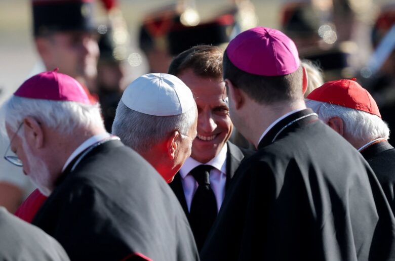 French President Emmanuel Macron and Pope Leo XIV meet with cardinals and bishops upon the pope's arrival at Paris-Orly Airport in Orly, near Paris, for a four-day apostolic journey to France, Sept. 25, 2026. (OSV News photo/Christian Hartmann, Reuters)