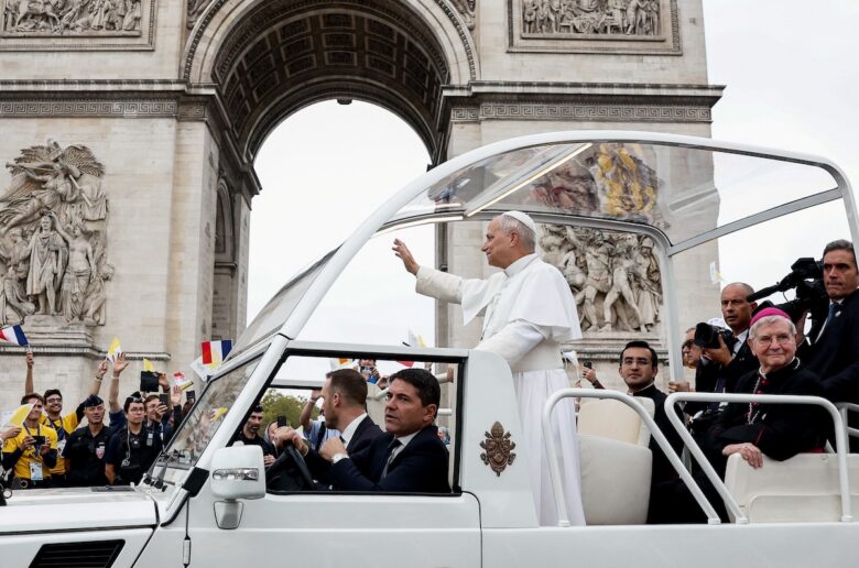 Pope Leo XIV travels in the popemobile on the Champs-Elysees avenue near the Arc de Triomphe to celebrate an open-air Mass at the Place de la Concorde during his four-day apostolic journey to France, Sept. 26, 2026. (OSV News photo/Benoit Tessier, Reuters)
