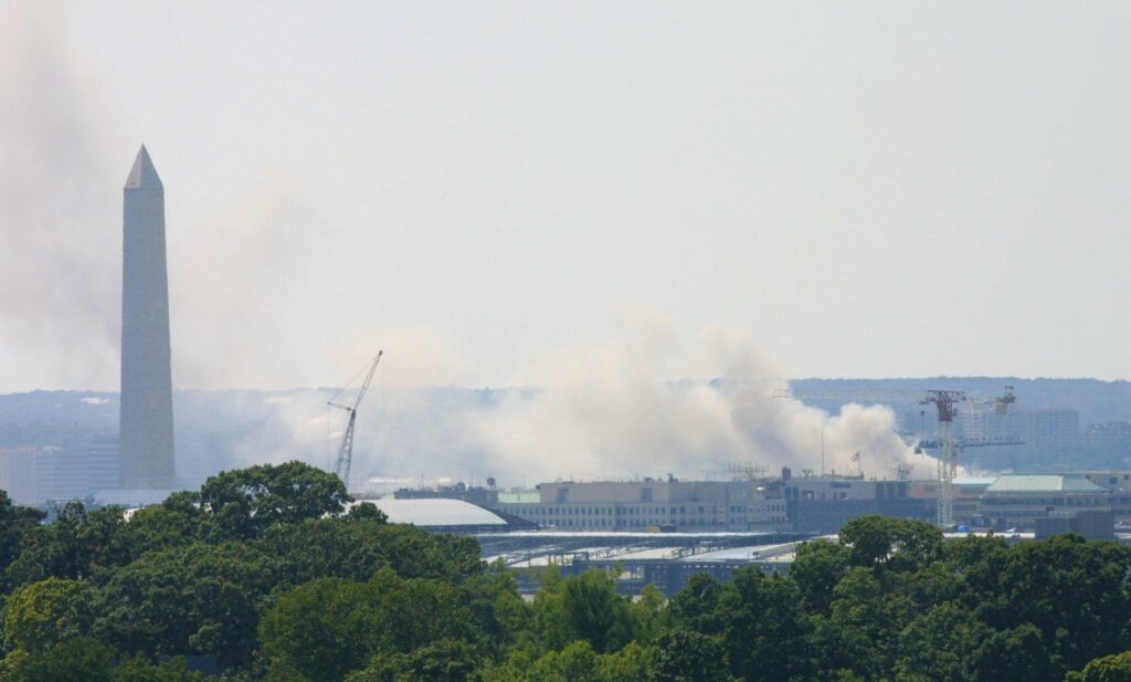 Smoke billows across Washington following the terrorist attack on the Pentagon building in Arlington, Va., Sept. 11, 2001, in this file photo. Hijackers flew a commercial airliner into the Pentagon the same morning two hijacked planes hit the Twin Towers of the World Trade Center in New York City and a fourth hijacked plane that was headed to Washington crashed in a field in Shanksville, Pa., after passengers and crew fought back against the hijackers. (OSV News photo/Bob Roller)