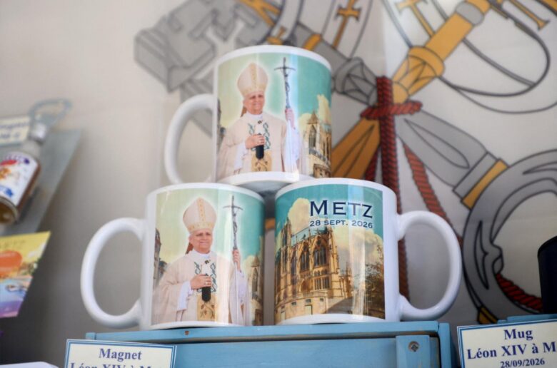 Mugs with pictures of Pope Leo XIV and Saint-Étienne Cathedral are displayed at the store windows of a souvenir shop ahead of his visit in the northeastern French city. Pope Leo will make an official apostolic journey to France Sept. 25-28. (OSV News photo/Ardee Napolitano, Reuters)