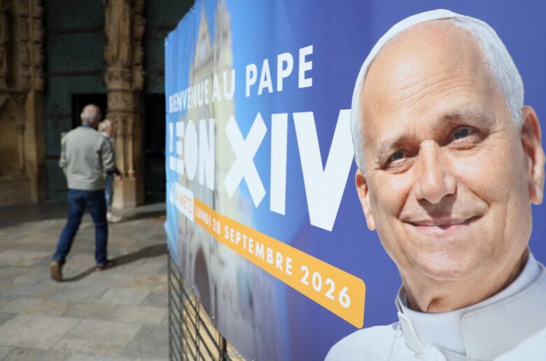 A man walks past a poster in front of Saint-Étienne Cathedral in Metz, France, Sept. 9, 2026, welcoming Pope Leo XIV ahead of his visit to the northeastern French city. Pope Leo will make an official apostolic journey to France Sept. 25-28. (OSV News photo/Ardee Napolitano, Reuters)