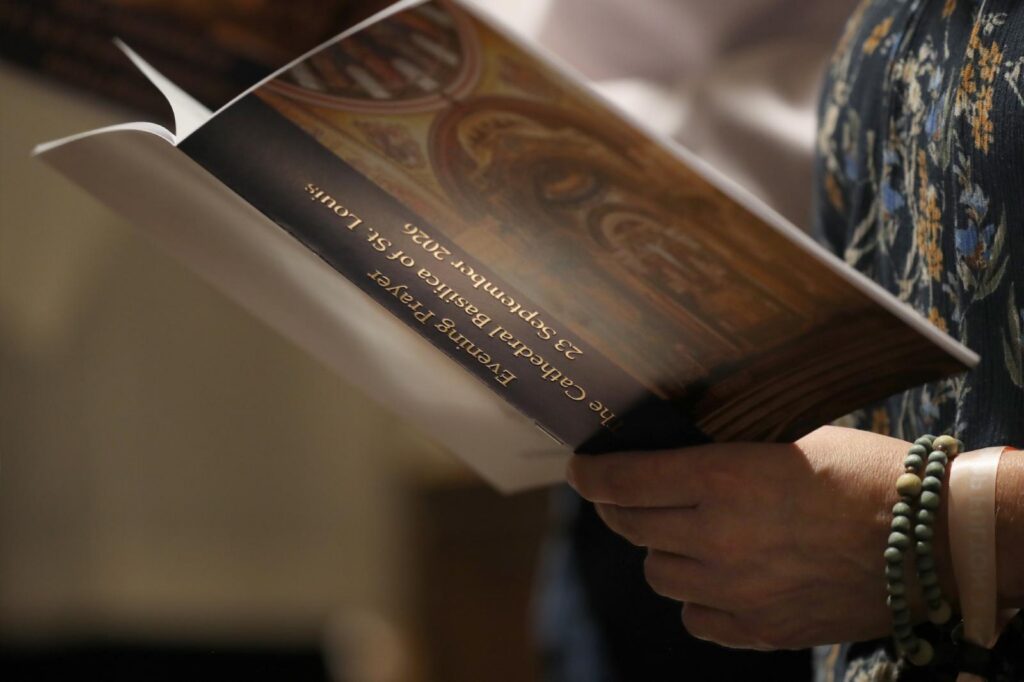 A woman holds a booklet during the vespers for Venerable Fulton J. Sheen Sept. 23, 2026, at the Cathedral Basilica of St. Louis, the eve of his beatification. Archbishop Sheen is remembered as one of the most influential and innovative evangelists in American history. (OSV News photo/Bob Roller)