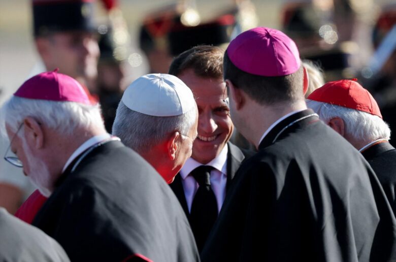 French President Emmanuel Macron and Pope Leo XIV meet with cardinals and bishops upon the pope's arrival at Paris-Orly Airport in Orly, near Paris, for a four-day apostolic journey to France, Sept. 25, 2026. (OSV News photo/Christian Hartmann, Reuters)
