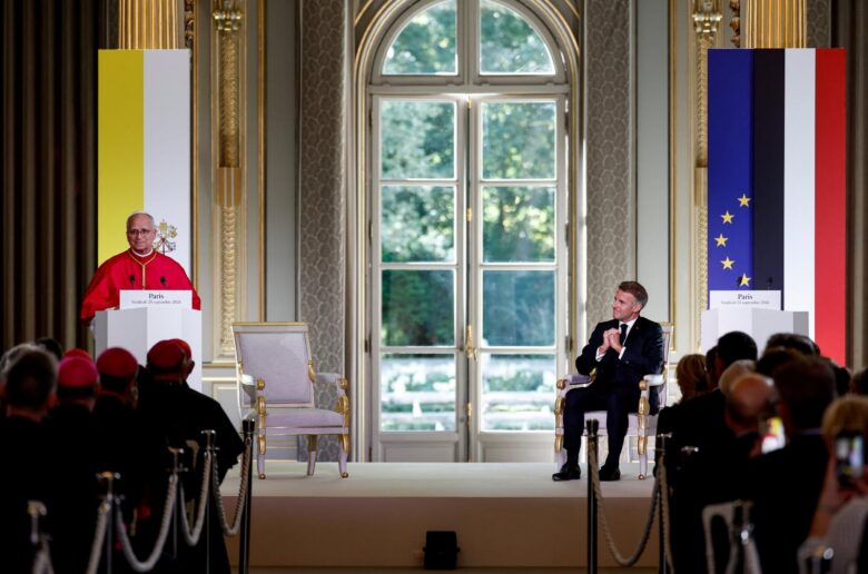 Pope Leo XIV delivers a speech during a meeting with authorities, members of civil society and the diplomatic corps at the Élysée Palace in Paris as French President Emmanuel Macron listens, on the first day of Pope Leo's four-day apostolic journey to France, Sept. 25, 2026. (OSV News photo/Benoit Tessier, pool via Reuters)