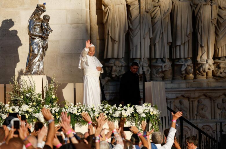 Pope Leo XIV waves towards the crowd at the end of a celebration of vespers with bishops, priests, deacons, consecrated men and women, and seminarians at Notre Dame Cathedral in Paris, France, Sept. 25, 2026. The visit to the iconic temple is part of the pope's four-day apostolic journey to France. (OSV News/Remo Casilli, Reuters)