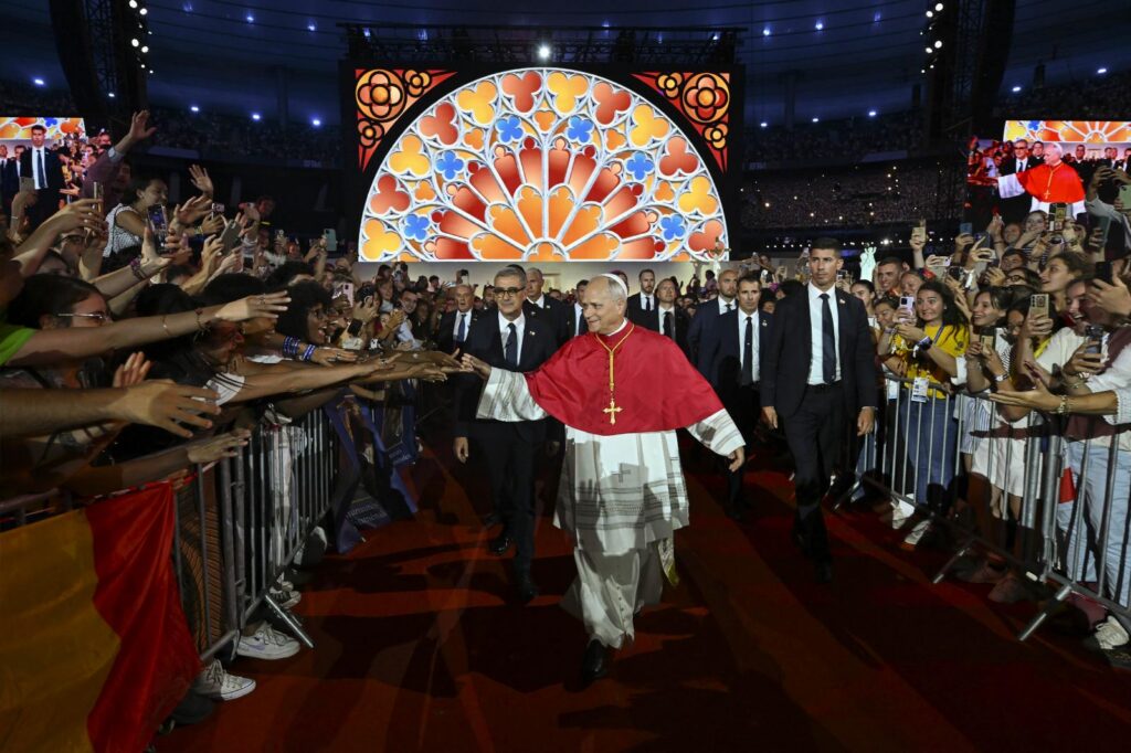 Pope encourages French youth to seek holiness during visually rich stadium vigil