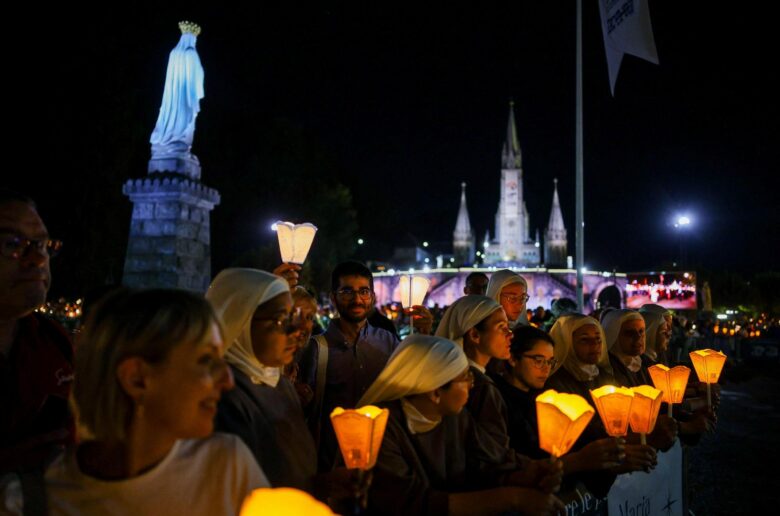 Faithful attend a candlelight procession with Pope Leo XIV at the Sanctuary of Our Lady of Lourdes during his four-day apostolic journey to France, in Lourdes, France, Sept. 27, 2026. (OSV News photo/Stephane Mahe, Reuters)