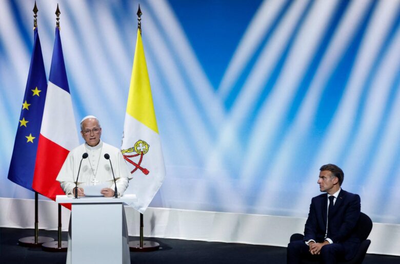 Pope Leo XIV delivers a speech, as French President Emmanuel Macron listens, during a meeting titled "At the Roots of Europe for Peace and Unity" at the Robert Schuman convention center in Metz Sept. 28, 2026, as part of Pope Leo's four-day apostolic journey to France. (OSV News photo/Remo Casilli, Reuters)