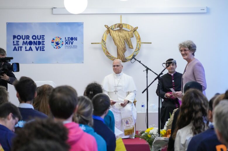 Pope Leo XIV listens to remarks by someone taking part in his visit to the Maison Bakhita Centre for Social Support and Integration in Paris Sept. 26, 2026. (CNS photo/Lola Gomez)