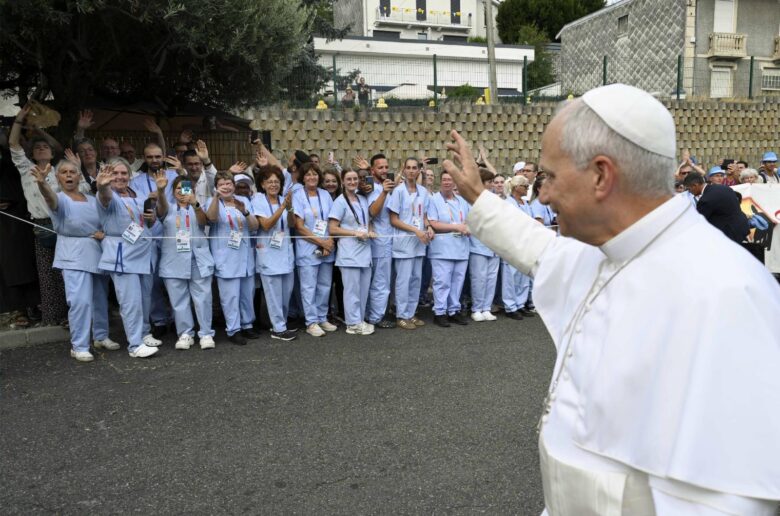 Pope Leo XIV waves to personnel of the Accueil Notre-Dame, which helps support the medical needs of visitors to the Sanctuary of Our Lady of Lourdes, in Lourdes, France, Sept. 27, 2026, during his four day apostolic journey in France. (OSV News photo/Simone Risoluti, Vatican Media)