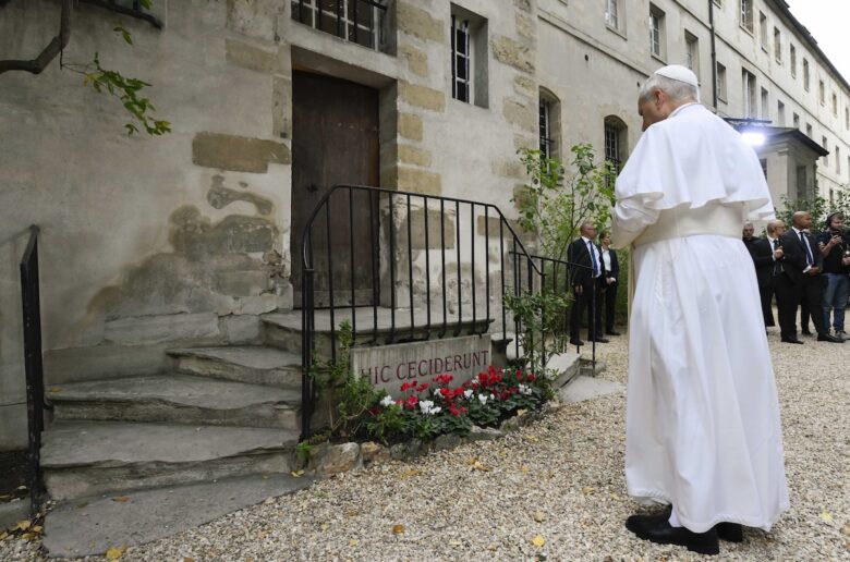Pope Leo XIV stops to pray Sept. 26, 2026, at the steps of the Church of Saint-Joseph-des-Carmes in Paris, commemorating the priests and bishops killed during the French Revolution. The Latin inscription, "Hic Ceciderunt," means "Here they fell." (CNS photo/Vatican Media)
