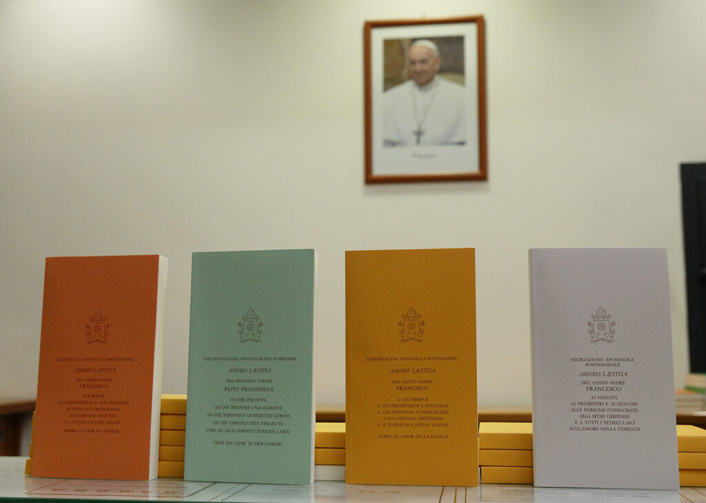 Copies of Pope Francis' apostolic exhortation on the family, "Amoris Laetitia" ("The Joy of Love"), are seen during the document's release at the Vatican April 8, 2016. The exhortation is the concluding document of the 2014 and 2015 synods of bishops on the family. (OSV News photo/Paul Haring, CNS file)