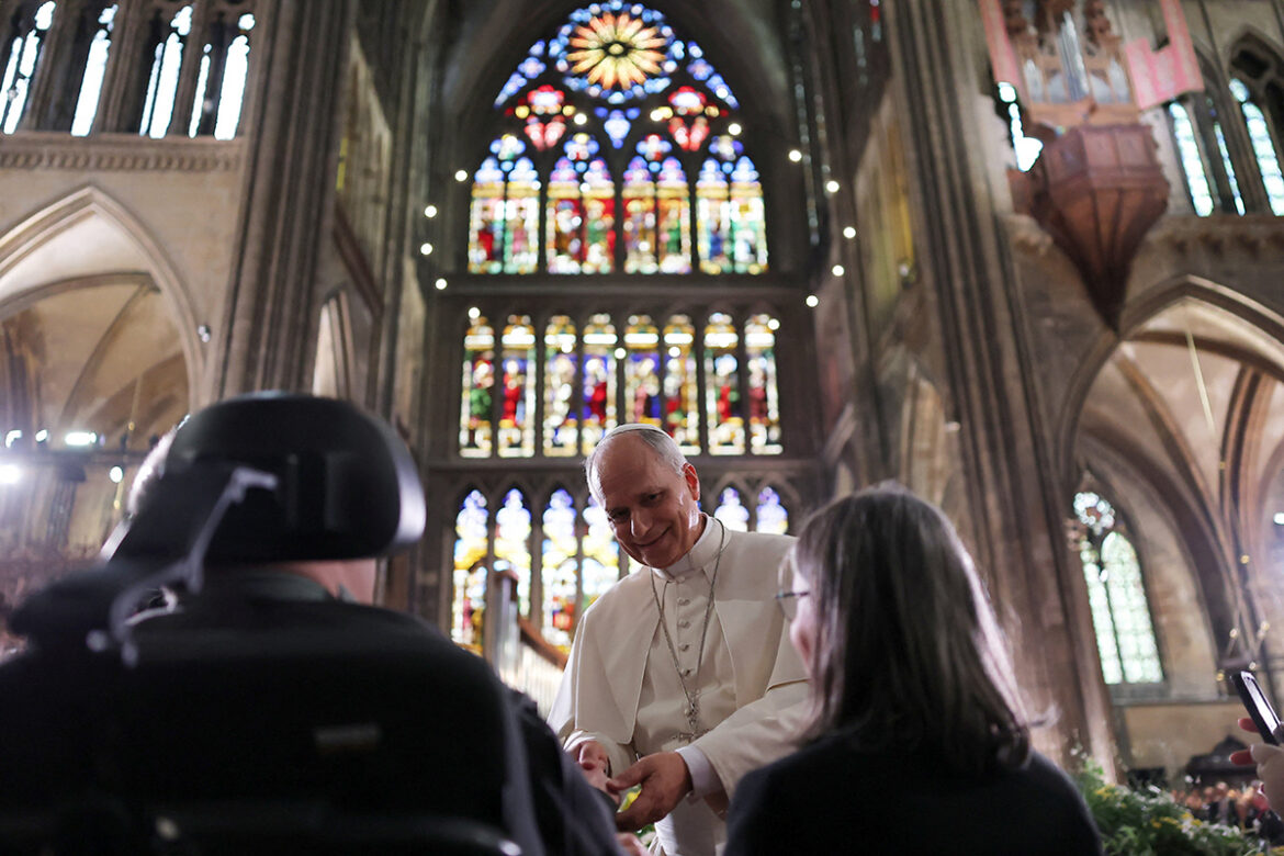 Pope Leo XIV greets a person with disabilities ahead of a Mass at Saint-Étienne Cathedral in Metz, France, Sept. 28, 2026, as part of his four-day apostolic journey to the country. (OSV News photo/Christian Hartmann, Reuters)