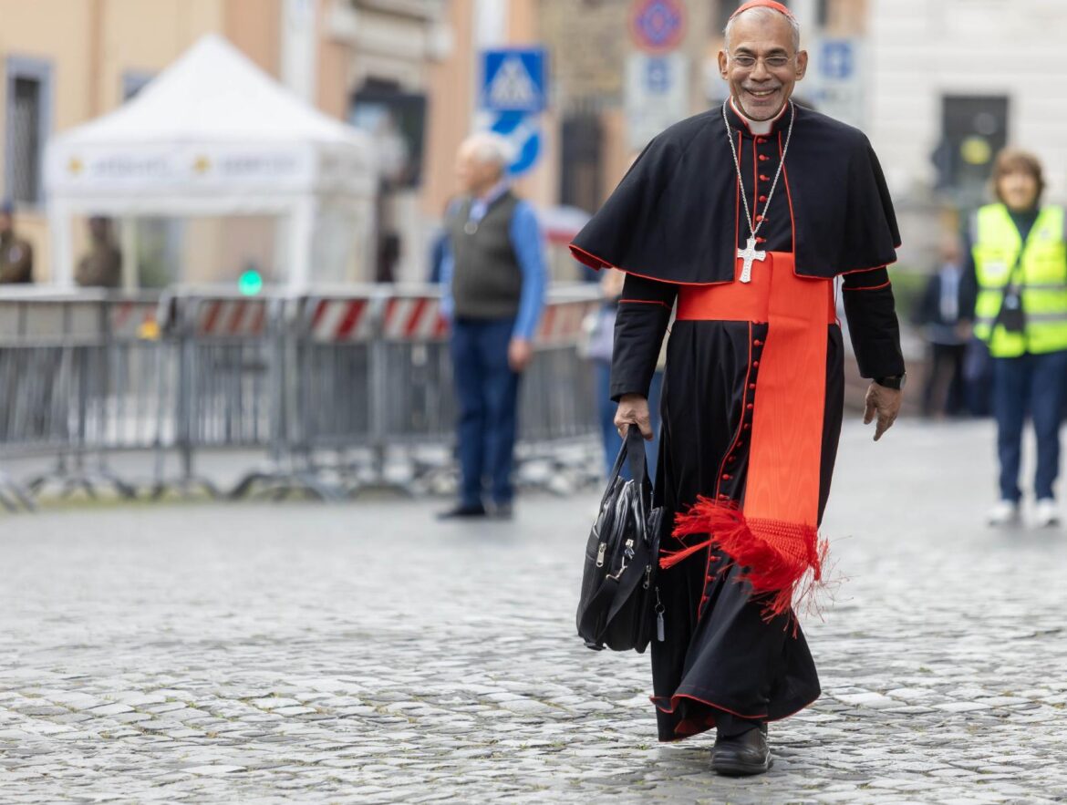 Cardinal Filipe Neri Ferrão of Goa, India, approaches the Petriano entrance to the Vatican ahead of the fifth general congregation meeting of cardinals April 28, 2025. On Oct. 8, 2026, the second day of Pope Leo XIV's meeting to mark the 10th anniversary of "Amoris Laetitia," Cardinal Ferrão told the Vatican bishops' meeting about success a parish in his archdiocese in India has had with pastoral family visits and phone-free family evenings. (CNS photo/Pablo Esparza)