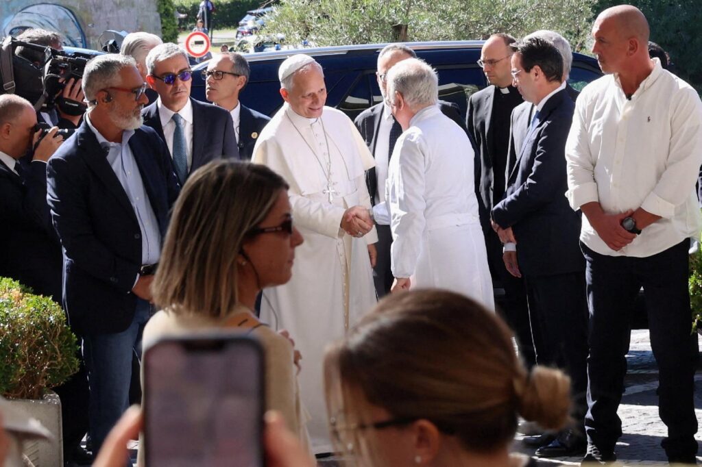Pope Leo XIV is greeted by Dr. Andrea Cambieri as the pontiff arrives at Rome's Gemelli Hospital Oct. 13, 2026, ahead of his surgery that afternoon to remove a lung nodule. The Vatican confirmed that evening that Pope Leo has lung cancer. (OSV News photo/Ciro De Luca, Reuters)