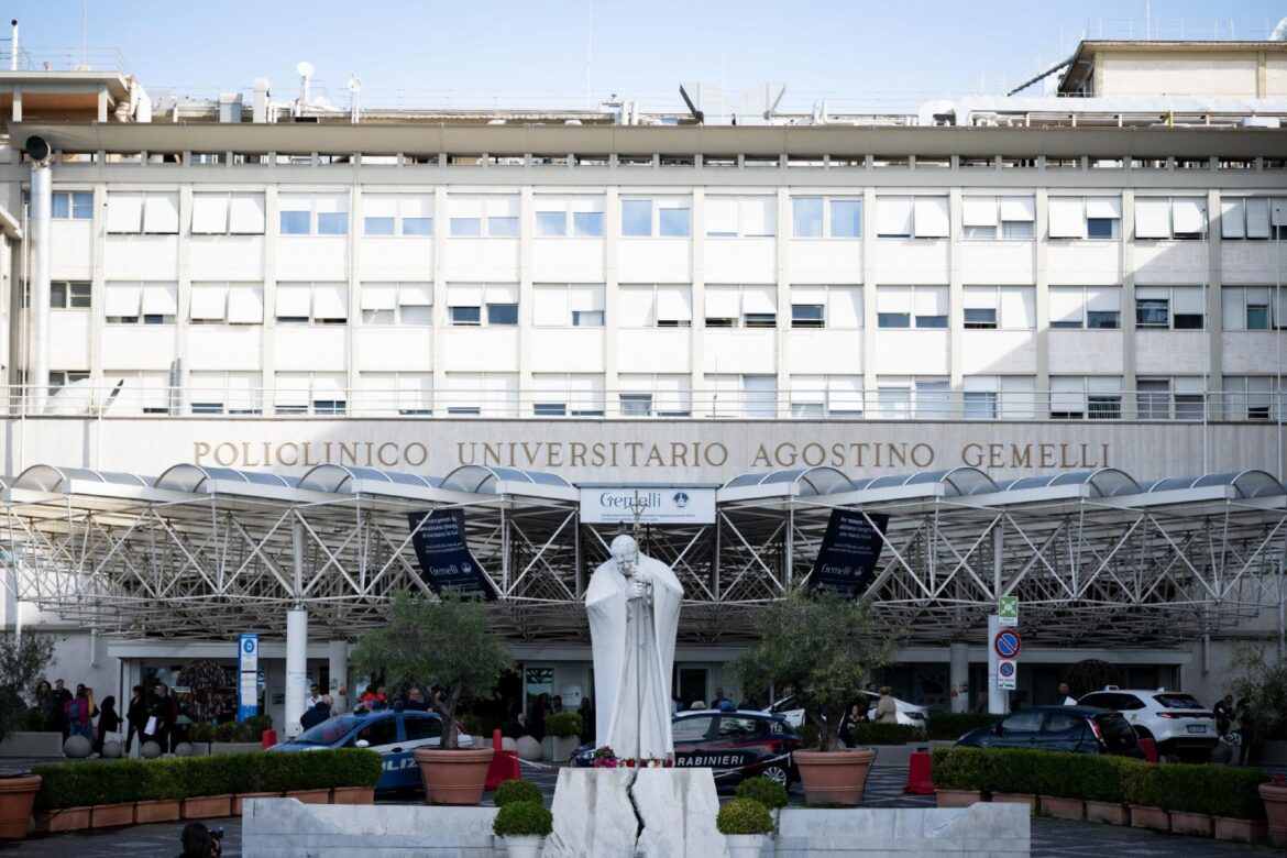 A statue of St. John Paul II Oct. 14, 2026, can be seen in front of Rome's Gemelli hospital where Pope Leo XIV is recovering from surgery during which doctors removed his lower right lung to treat a cancerous tumor. (CNS photo/Cristian Gennari)