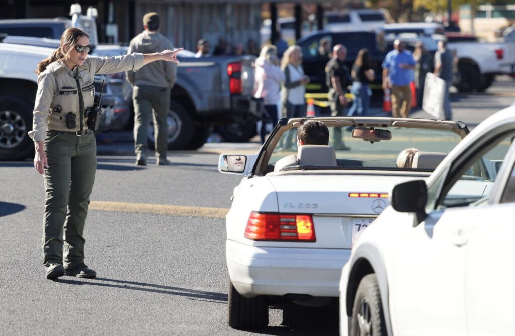 Emergency personnel direct traffic for parents and guardians in the parking lot of a family reunification location at Journey Church in Bend, Ore., Oct. 15, 2026, following a shooting at Silver Rail Elementary School. A 16-year-old opened fire at the elementary school killing at least three children and a teacher before he was shot by a person at the scene who pursued him into the school, authorities said. (OSV News photo/Rob Kerr, Reuters)