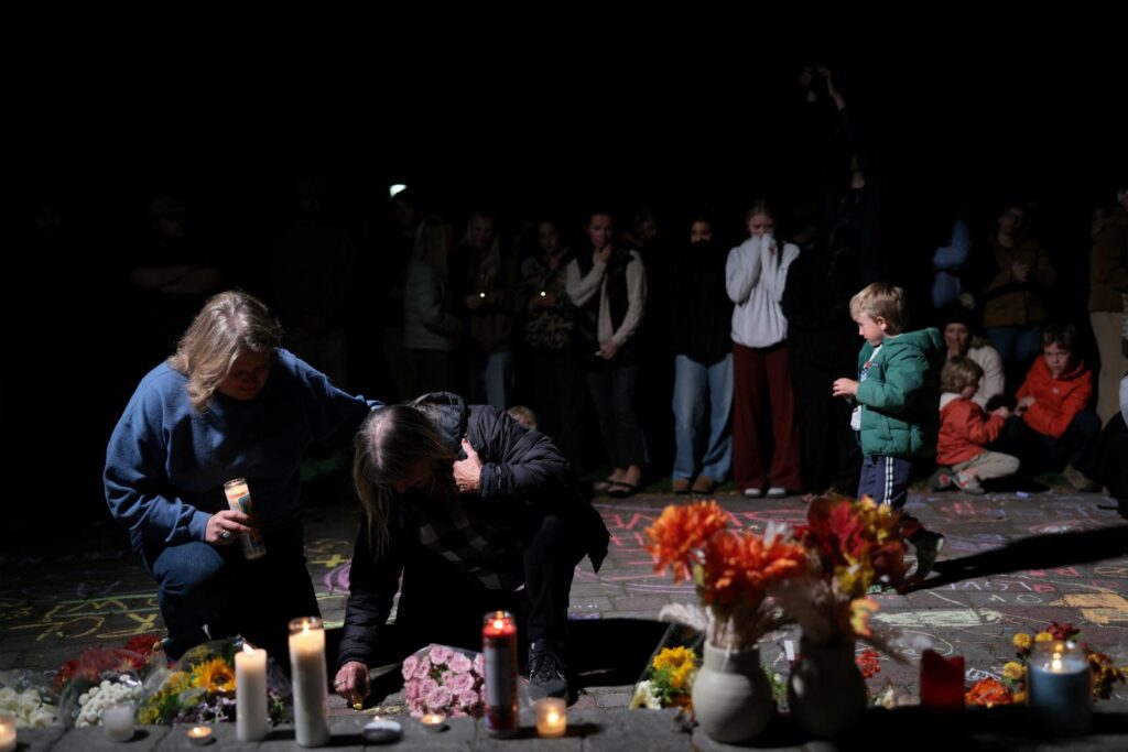 People take part in a candlelight vigil at Drake Park for victims of the Silver Rail Elementary School shooting, in Bend, Ore., Oct. 15, 2026. A 16-year-old opened fire at the elementary school killing at least three children and a teacher before he was shot by a person at the scene who pursued him into the school, authorities said. (OSV News photo/Rob Kerr, Reuters)